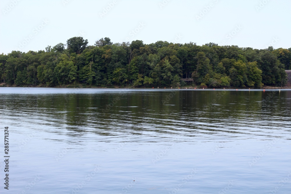 A lake side view of the calm waters of the lake.