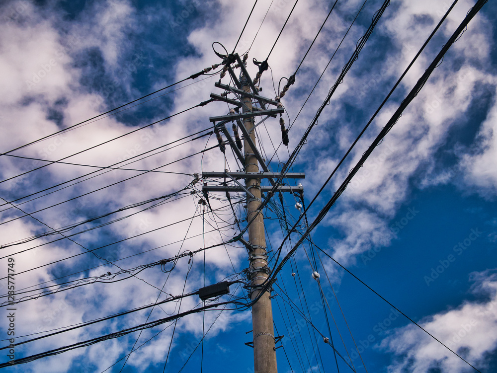 Highly loaded urban electricity pole showing many cables, taken in Japan. Highly loaded urban electricity pole showing many cables, taken in Japan.