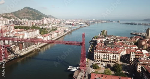 Aerial view of modern Vizcaya bridge crossing  river at Portugalete, Spain photo