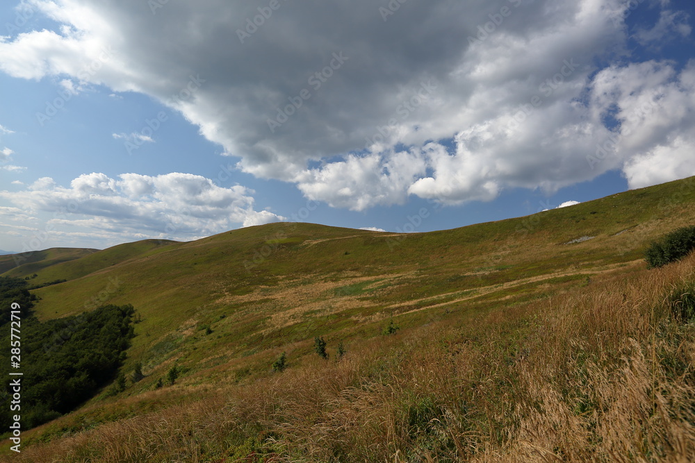 Bieszczady mountains in poalnd, landscape with hills and clouds over it