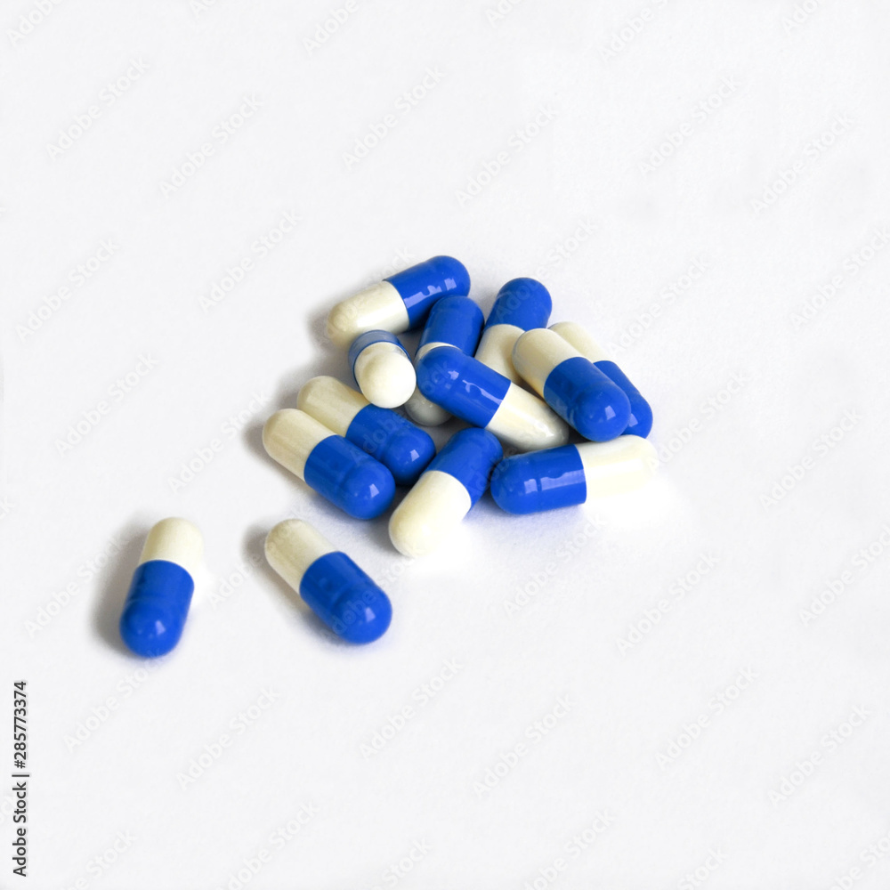 pills, capsules, white-blue on a white background