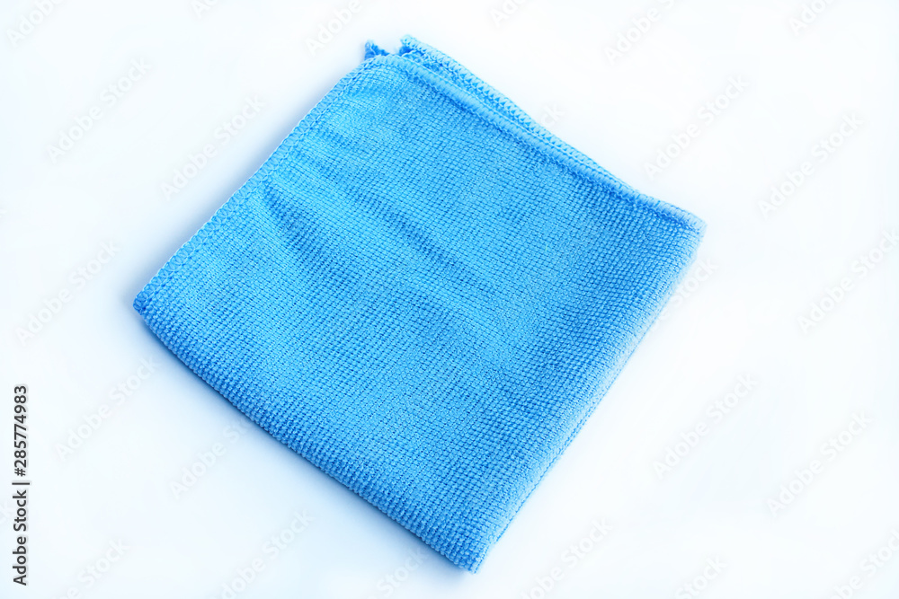Bright blue towel on a white background. Bright blue towel on a white background.