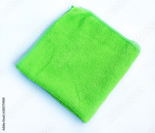  Bright green towel on a white background.