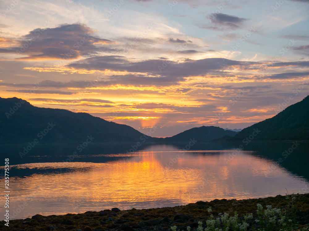 Golden sunset mountains on the Norwegian sea