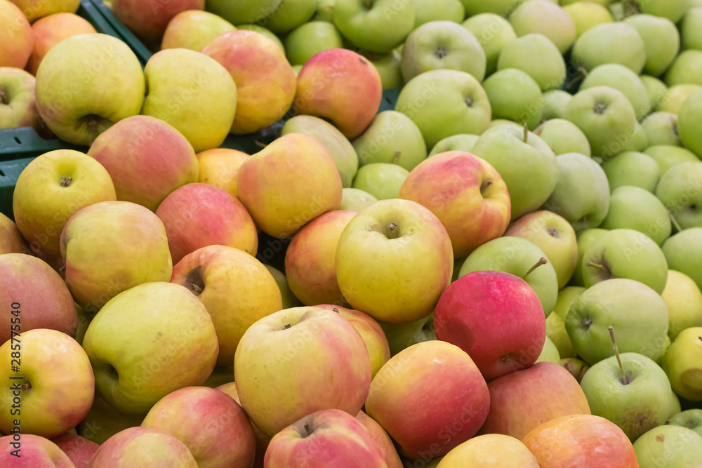Showcase with apples in a supermarket. A lot of green apples. The choice of products. Fruit Showcase with apples in a supermarket. A lot of green apples. The choice of products. Fruit