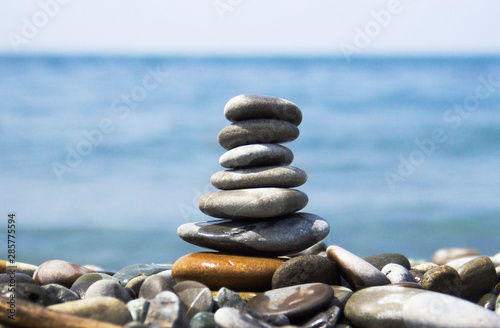  cairn on the background of the sea