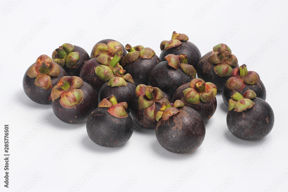 Mangosteens on white background, Pile of mangosteens Mangosteens on white background, Pile of mangosteens