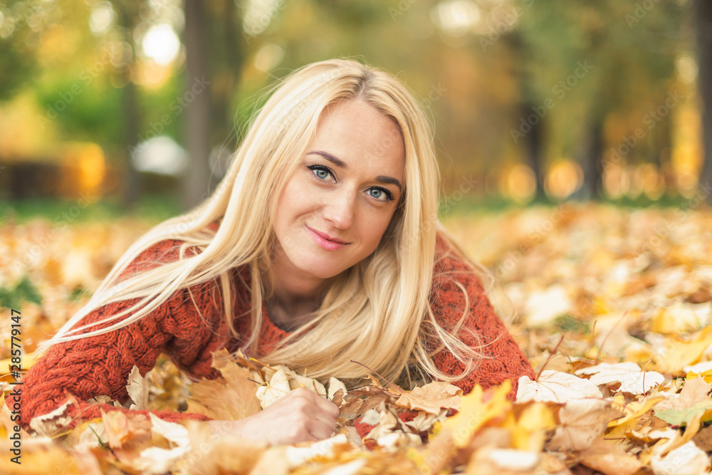 Beautiful blonde female with blue eyes at the park Beautiful blonde female with blue eyes at the park