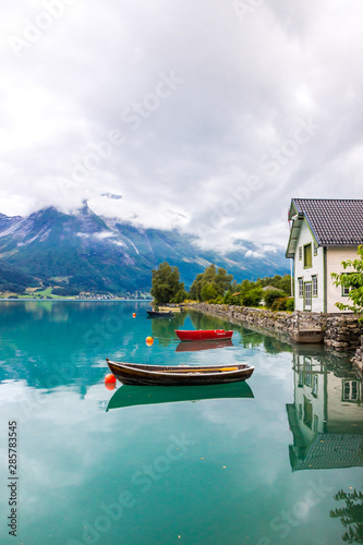 clouds over Oppstryn lake in Hjelle in Norway photo