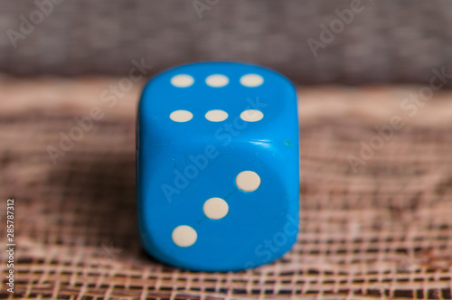 Blue dice on table.Social game