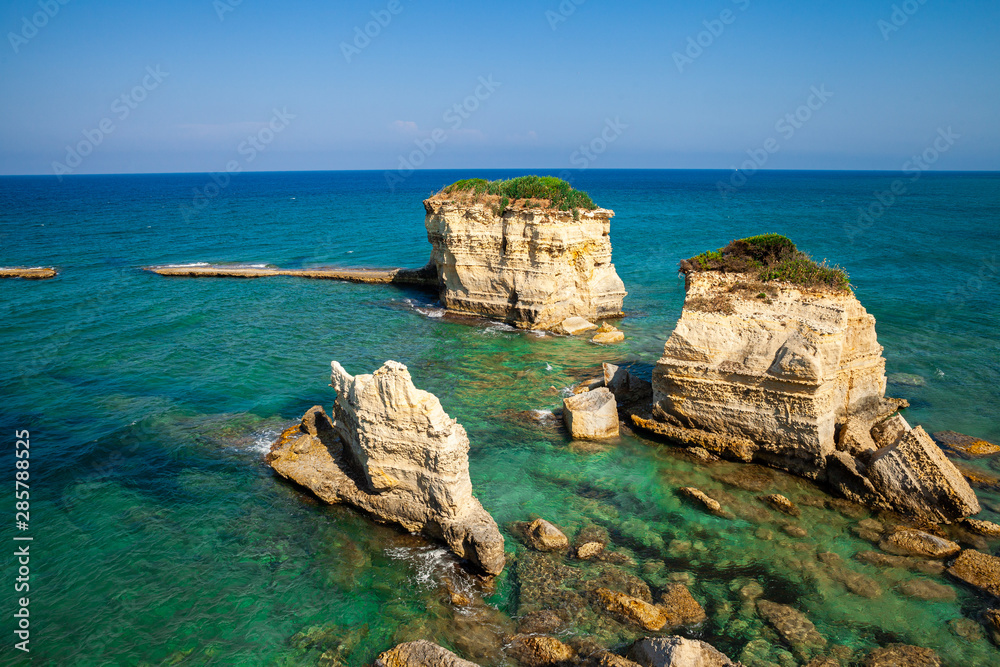 Torre Sant Andrea, Rocky beach in Puglia, Italy. Salento sea coast, cliffs in the clear adriatic sea