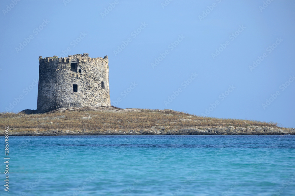 Old lookout tower La Pelosa on an islet near Stintino in the northern Sardinia