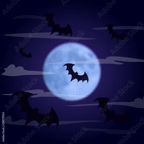 Halloween background. Bats fly in the dark foggy sky against the background of the moon