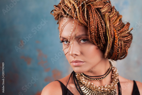 Southern flavor. Close-up portrait of a young, gorgeous, fatal beauty with an afro braid hairstyle.