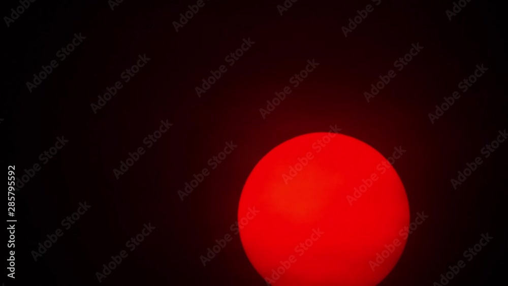 Red sun sphere in thick smog Red sun sphere in thick smog
