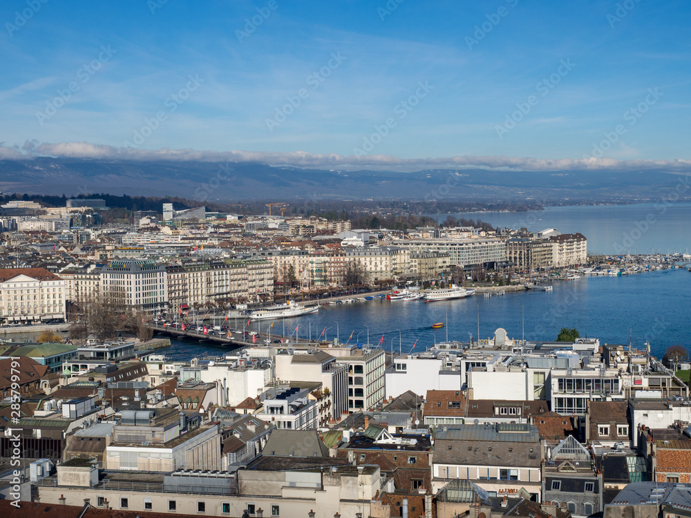Switzerland, february 2018: Panorama of the Old City of Geneva with Lake Geneva and the fountain Jet D'eau from Cathedral of Saint-Pierre, Geneva.