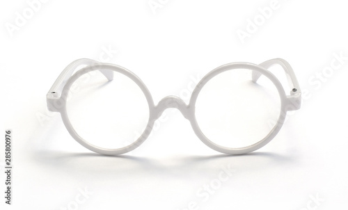 White glasses placed on a white background with reflections below