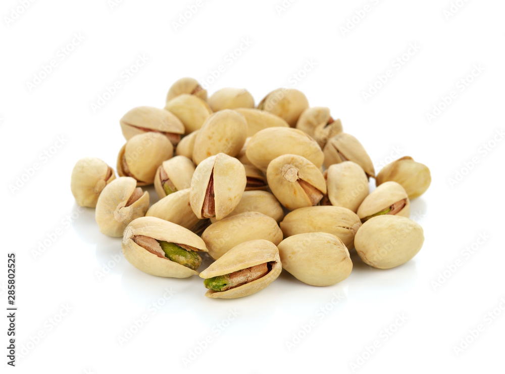 Pistachio nuts. Isolated on a white background. Pistachio nuts. Isolated on a white background.