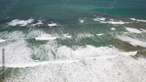 Aerial view of breaking waves on a seashore