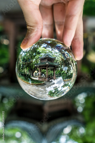 Glass Ball and Chinese traditional architecture at Zhongshan park. Foshan city, Guangdon province, China photo