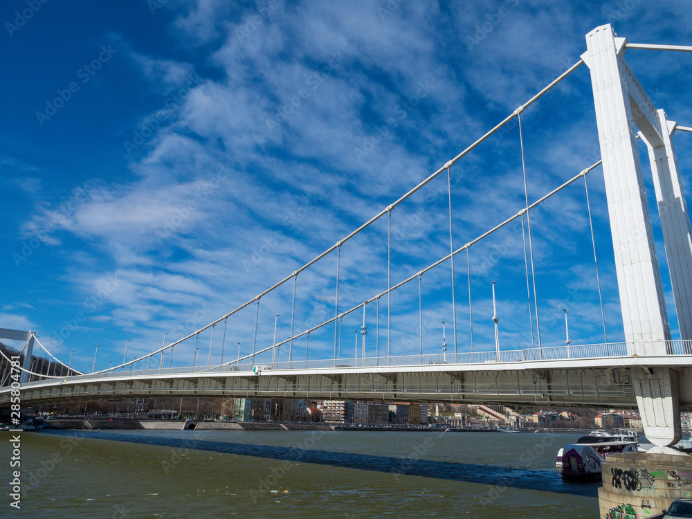 Fototapeta premium Elisabeth Bridge (Hungarian: Erzsébet híd) is the third newest bridge of Budapest, Hungary, connecting Buda and Pest across the River Danube. The bridge is situated at the narrowest part of the Danube