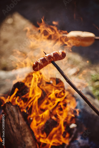 Sausage on a stick over the fire
