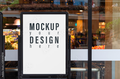 Mockup advertising board in front  of supermarket. Mock up billboard for your text messege or mock up content with department store or shopping mall background. © ezstudiophoto