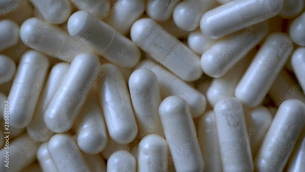 Close-up of A Rotating Heap of Capsules, Pharmacy Background With Selected Focus Close-up of A Rotating Heap of Capsules, Pharmacy Background With Selected Focus