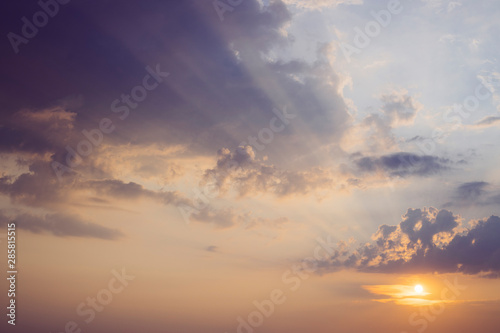 Fototapeta Naklejka Na Ścianę i Meble -  Sun low in the sky under light clouds