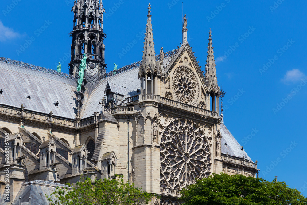 View of the original Notre-Dame de Paris church, before the fire lit up in april 2019. Is a medieval Catholic cathedral and is considered to be one of the finest examples of French Gothic architecture View of the original Notre-Dame de Paris church, before the fire lit up in april 2019. Is a medieval Catholic cathedral and is considered to be one of the finest examples of French Gothic architecture