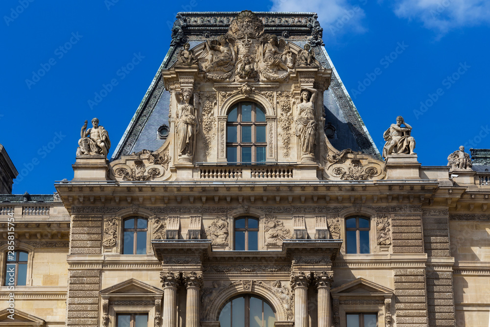 Gable of the Pavillon Colbert of the Louvre in Paris, France. Is the world's largest art museum and is housed in the Louvre Palace, originally built in the late 12th to 13th century.