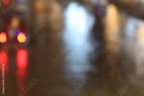 Night twilight blurred bokeh floating market water front, abstract background