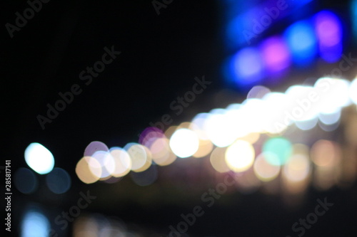 Night twilight blurred bokeh floating market water front, abstract background © Peerapong