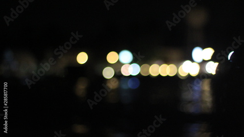 Canvas Print Night twilight blurred bokeh floating market water front, abstract background