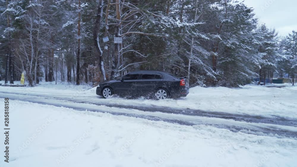 Car drives in the winter on deep snow in the forest 4K Car drives in the winter on deep snow in the forest 4K