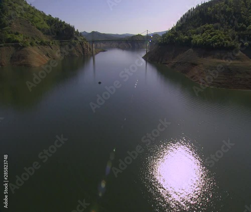 Aerial over a river and bridge in california. photo