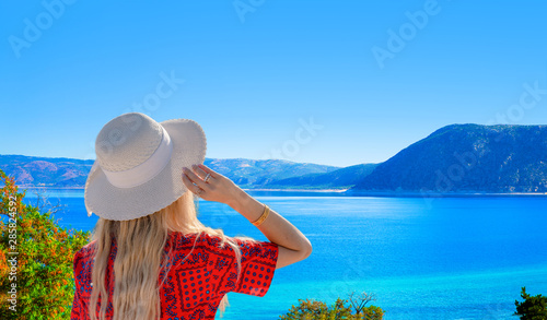 Fototapeta Naklejka Na Ścianę i Meble -  The girl with white hat looking Lake Salda from hill, Burdur, Turkey