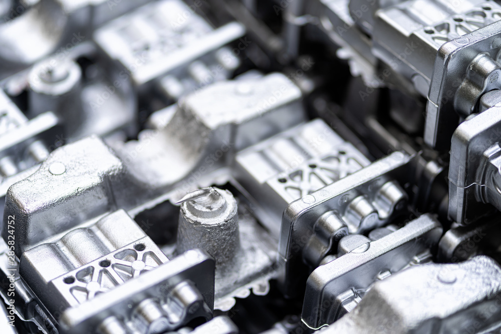 Naklejka premium Pile of aluminum automotive parts, casting process in the automotive factory