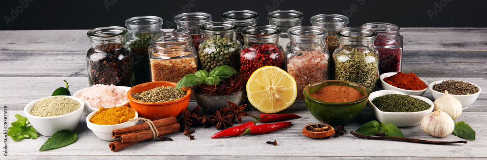 Fototapeta Spices and herbs on table. Food and cuisine ingredients with pepper
