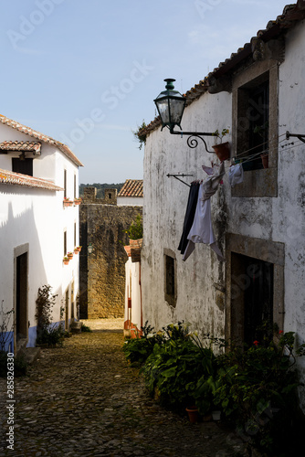 Narrow streets and white houses of old town, Obidos, Portugal