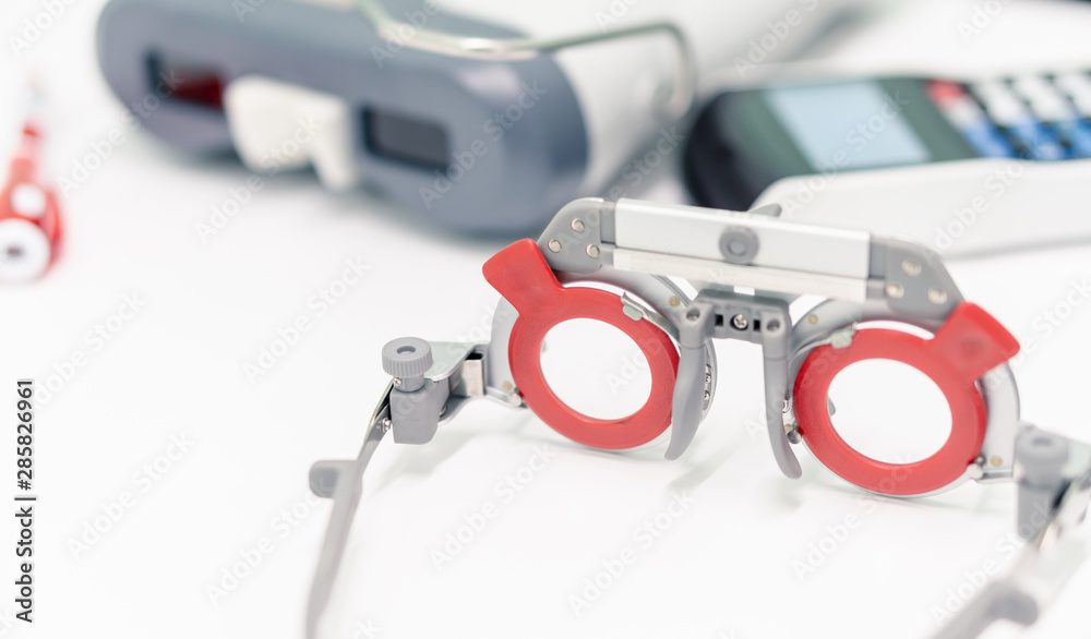 optical trial lens glasses frame with PD meter on the background at optician clinic, ophthalmologist eyes test tool for optician optical trial lens glasses frame with PD meter on the background at optician clinic, ophthalmologist eyes test tool for optician