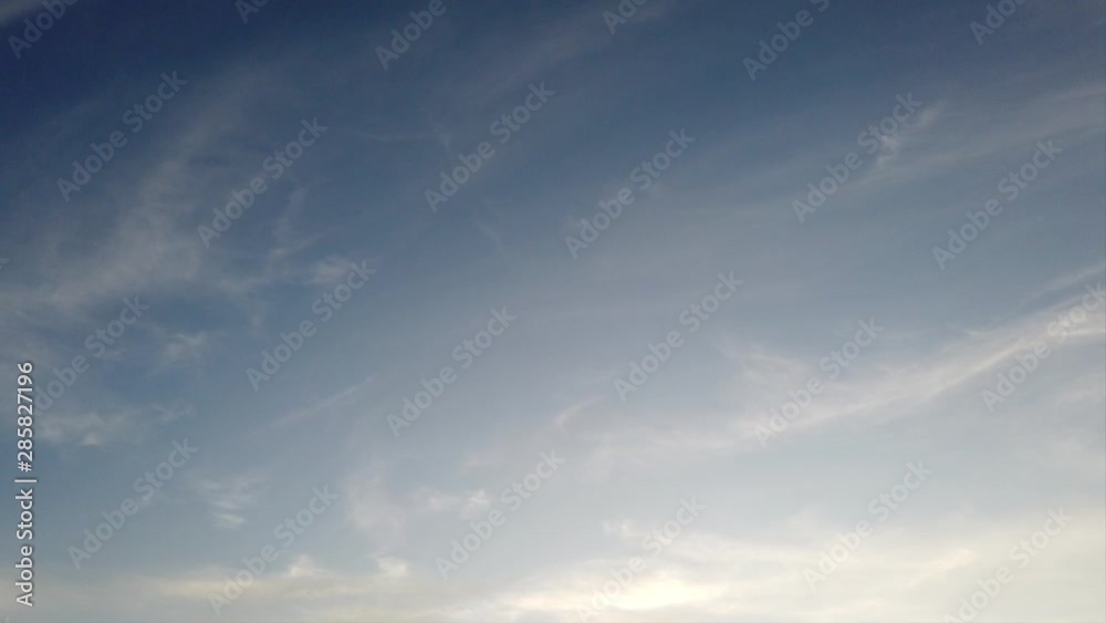 Beautiful and relaxing sky with timelapse striped clouds, bright afternoon clouds moving slowly in the air
