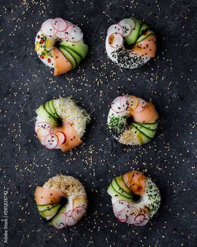 Sushi donuts on dark background. Top view.