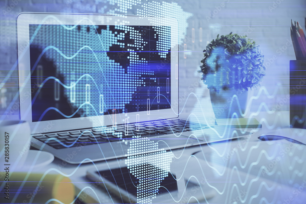 Stock market chart hologram drawn on personal computer background. Double exposure. Concept of investment. Stock market chart hologram drawn on personal computer background. Double exposure. Concept of investment.