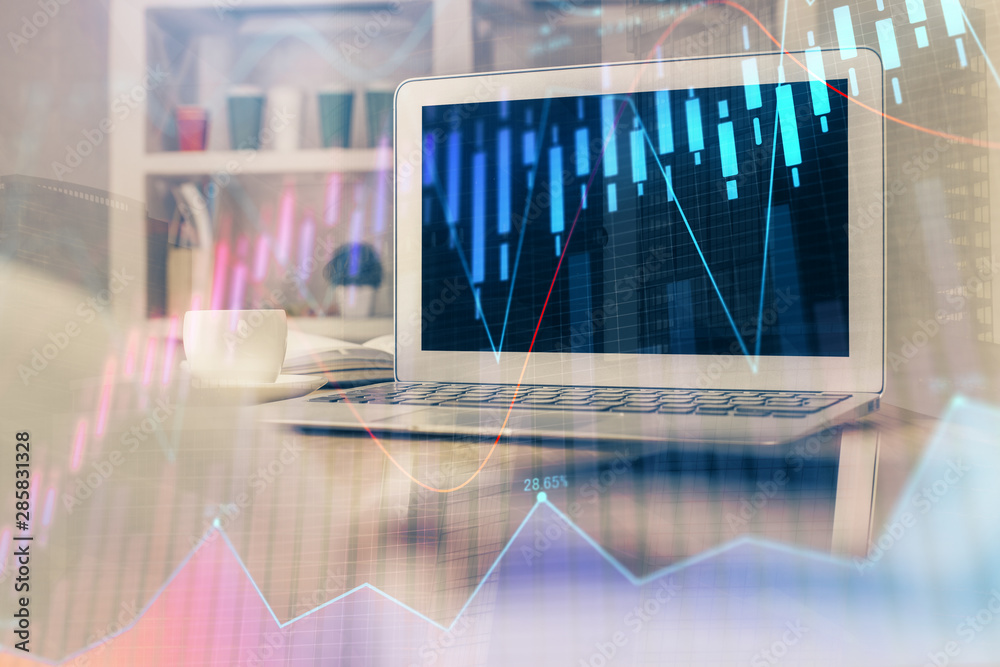 Forex market chart hologram and personal computer background. Double exposure. Concept of investment. Forex market chart hologram and personal computer background. Double exposure. Concept of investment.