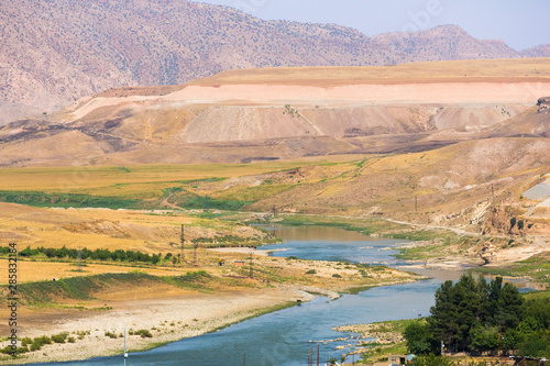 Panoramic view of Tigris river and valley and beautiful mountains near Hasankeyf town, Turkey, Eastern Anatolia photo