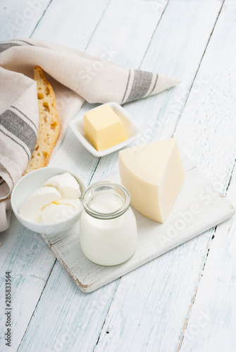 dairy products on old white wooden table photo