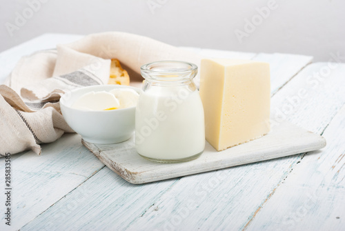dairy products on old white wooden table