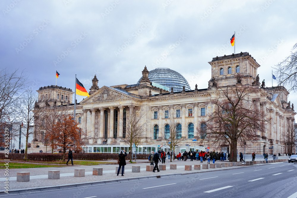 Reichstag building architecture with German flags in Berlin
