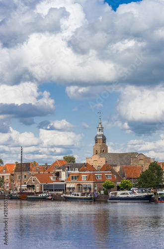 Boats and church tower of historic village Blokzijl, Netherlands